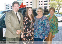 During the 2010 event, Sheryl Letterman of Women in Need, second from right, presents a donated vehicle to Jessica Jones, second from left, with Rick Hughlett of Rick's Automotive and Dianne Elizabeth Osis of Springfield Business Journal.