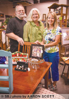 From left, Curiosity Shoppe owners David and Leslie Jones work with 20 vendors, including Pam Lovewell, their first cosignor and vendor, at their Nixa upscale flea market. The store is preparing for a move to a more visible spot on Aldersgate Drive.