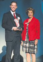 2010 40 Under 40 recipient Jeff Houghton receives his award from Springfield Business Journal Publisher Dianne Elizabeth Osis.