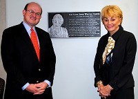 OTC President Hal Higdon and Carol Jones pose in front of an honoring plaque for the newly renamed Carol Jones Writing Center.Photo provided by OTC