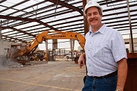 Rich Kramer is glad to be putting crew members back to work after business conditions led him to lay off about 20 percent of his staff in the spring. Here, RKC crews demolish a building to make room for construction of a highway maintenance facility.