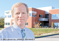 Michael Murphy, president and CEO of Coventry Health Care of Kansas Inc., manages Mercy Health Plans' Springfield headquarters, 4520 S. National Ave. The center pays 2.5 million claims per year.