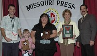 Kevin Jones (right), 2010 president of the Missouri Press Association, presents awards to (from right to left) SBJ Publisher Dianne Elizabeth Osis, Features Editor Maria Hoover, Hoover's daughter Kaitlyn, and Editor Eric Olson.