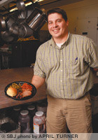 Jason Conover of Catering Creations plans to hand out samples of sliced brisket and sweet green beans to reach new customers at the 2010 Business &amp; Technology Expo.