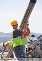 Woods Construction workers fuse pipeline together near the intersection of Shepherd of the Hills Expressway and Highway 248 for Southern Missouri Natural Gas' Branson project.