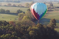 Rick Hughlett pilots his own hot air balloon, which holds three people and a pilot. He often donates flights to local nonprofits.