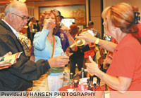 Above, guests sample wine at the 2010 Missouri Wine Festival at Chateau on the Lake. The event, in its second year in Branson, drew 71 booths showcasing regional beer, wine, spirits and fine food.