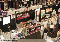 Convention-goers peruse booths at the $47 million Branson Convention Center, which has upped the ante in local convention competition.
