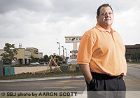 Andrew Covington near the construction site for his newest Ashley Furniture Homestore.