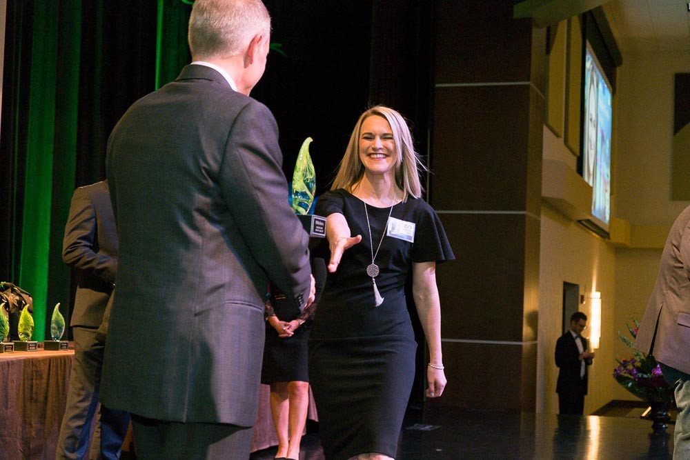 20th CLASS
Springfield Business Journal ushers in the 20th class of 40 Under 40 honorees during a March 22 event at Oasis Hotel & Convention Center. Heather Lewis of KOLR-TV, above, accepts her award. Two records were set at the event: about 500 people in attendance and over $17,000 raised for the charity partner, Children’s Miracle Network of CoxHealth.