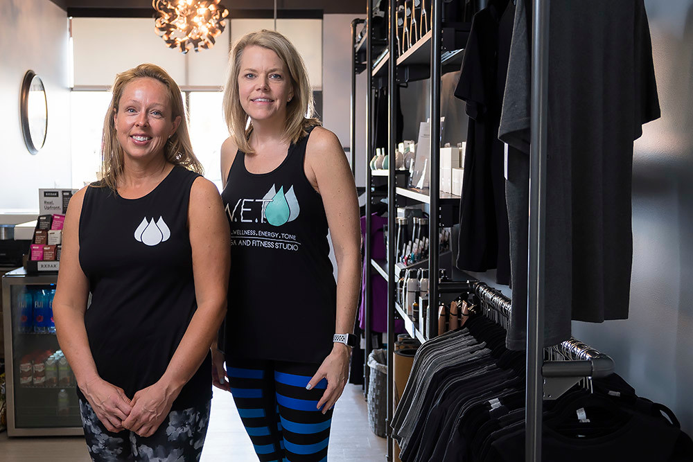 Shelli Luke, left, manages operations for Virginia Bailey and other owners of the newly opened SWET yoga studio.