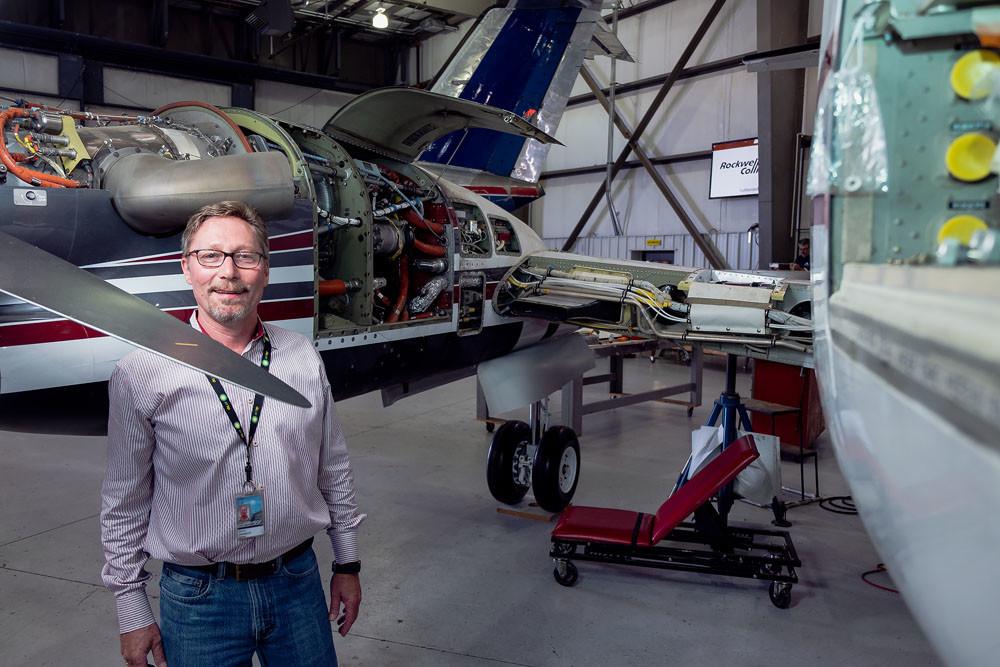Worldwide Aircraft Services Inc. Administrator Dave Vorbeck poses with a plane that is currently being serviced.