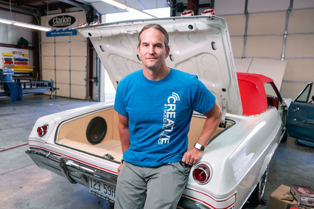 CUSTOMIZATION: Creative Audio owner Don Fleury is working on installing a custom-built trunk unit in this 1965 Chevy Impala.