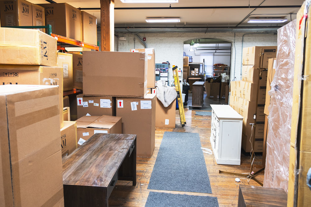 Boxes of furniture wait to be unpacked amid the weeklong store renovation.