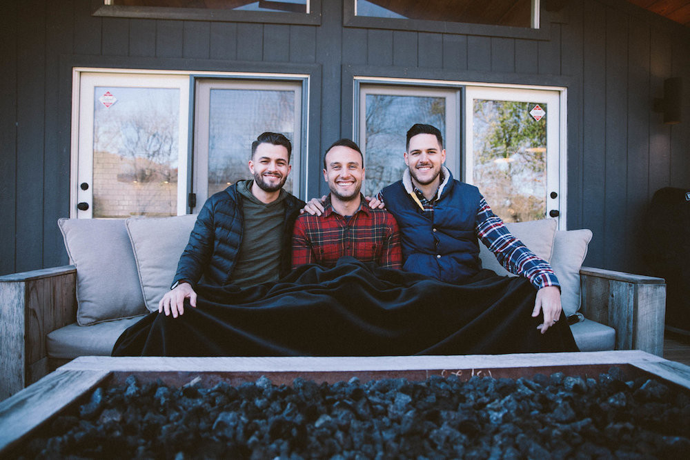 From left, Josh Stewart, Bryan Simpson and Dane Watts don the Big Blanket Co.’s signature product.