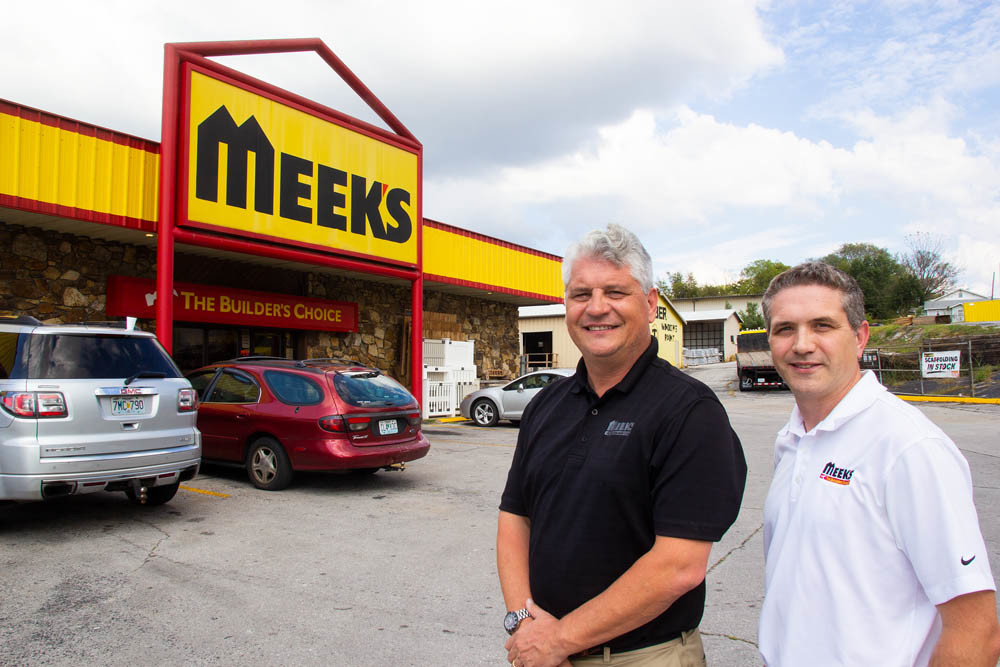 Despite selling in September, Meek’s Lumber Co. retains its name and management. Charlie, left, and Mike Meek are pictured outside a store.