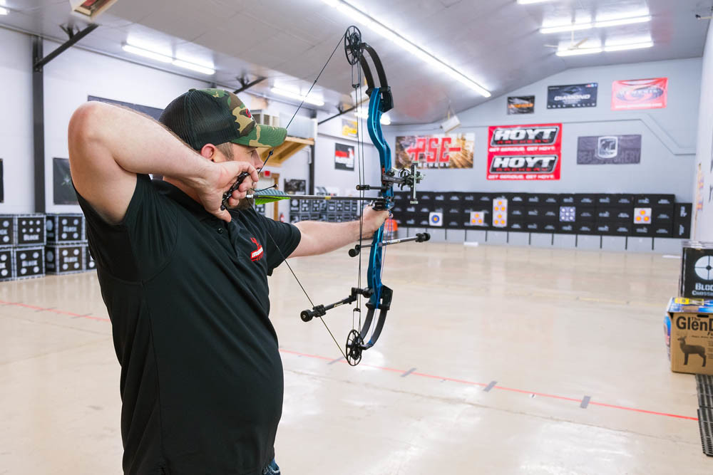 Brad Williams draws his bow at Midwest Archery’s 10-lane range.