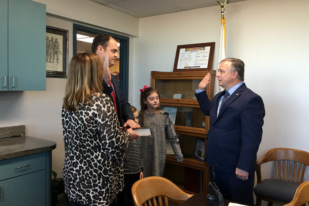 I SOLEMNLY SWEAR
Greene County Clerk Shane Schoeller, far right, swears in John Russell on Jan. 8 as interim Greene County District 2 Commissioner to succeed Lincoln Hough. Russell is president and co-founder of Pillar Insurance LLC.