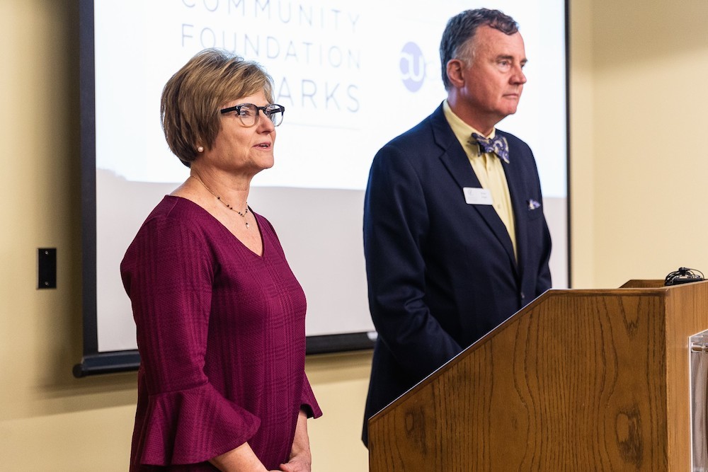 Multipli Credit Union President Judy Hadsall and Community Foundation of the Ozarks CEO Brian Fogle announce the program on Monday.