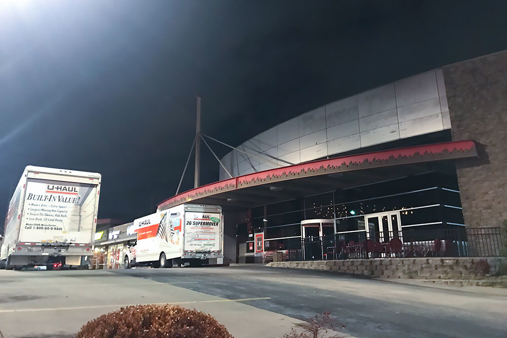 U-Haul trucks are seen parked outside Famous Dave’s on Monday night.