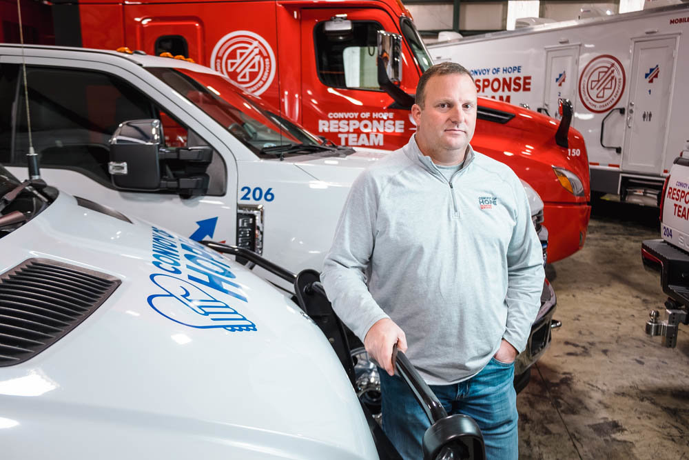 AID WITHOUT BORDERS: Stacy Lamb, who leads Convoy of Hope’s national disaster response team, is surrounding by a fleet of specialty vehicles to reach disaster survivors.