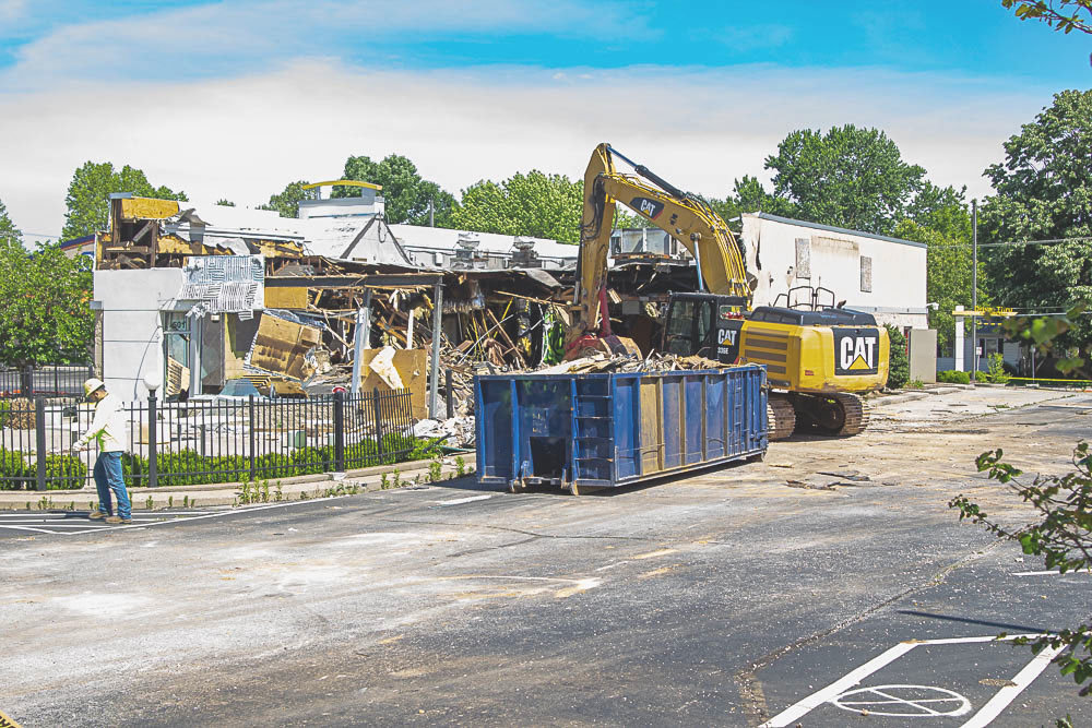 Crews work to demolish a McDonald’s restaurant that’s been closed for nearly a year.
