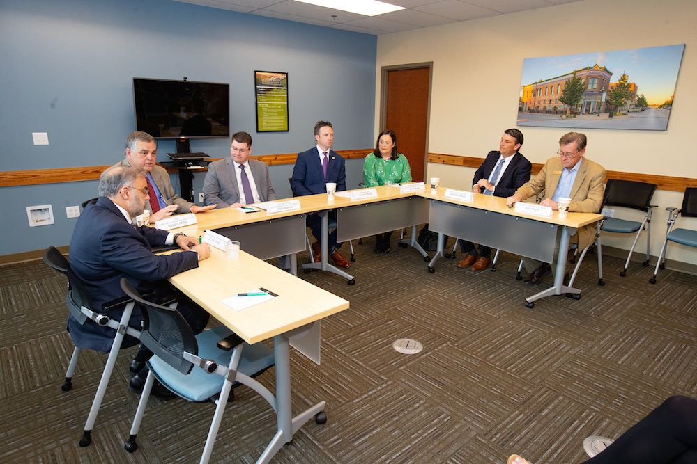 Officials participate in a roundtable discussion on Tuesday.