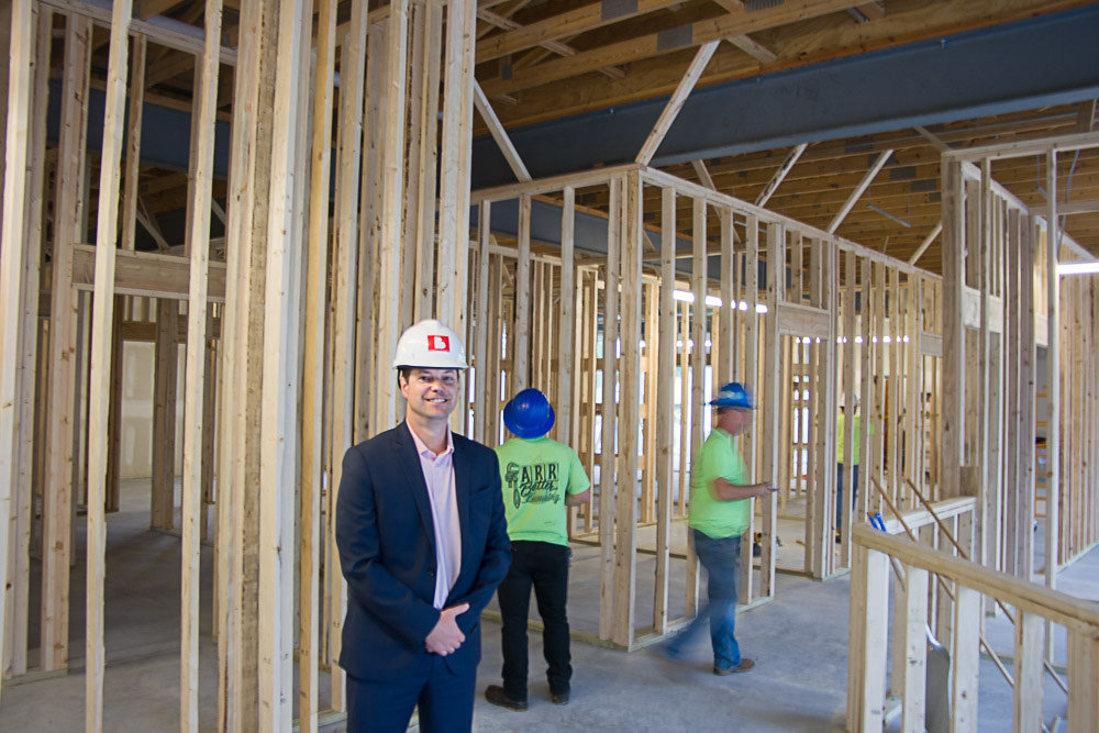 IMAC Holdings CEO Jeff Ervin checks up on construction at the Ozzie Smith clinic in the Sagamore Hill Center.