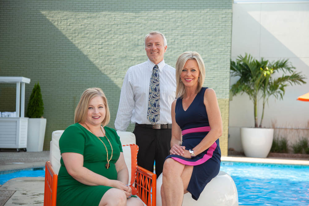 Sarah DeGuire, from left, John Blansit and Missy Handyside lead the way at Oasis Hotel & Convention Center.