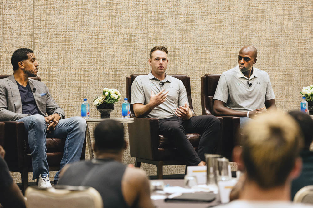 As former NBA player Jim Jackson listens, Kelly Byrne, center, managing member of Say You Can LLC, and business partner and NBA player Anthony Tolliver, share insight during a July 2018 real estate panel discussion in Las Vegas.