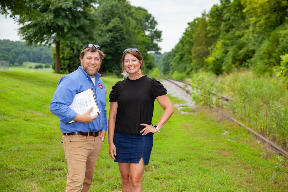ON THE PATH: City of Ozark’s Jeremy Parsons and Ozark Greenways’ Mary Kromrey stand near the planned Chadwick Flyer Rail Trail intersection with the James River Greenway.