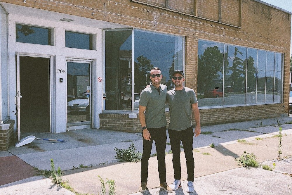 Hook Creative LLC’s Bryan Simpson and Josh Stewart stand outside the company’s new 8,200-square-foot building.