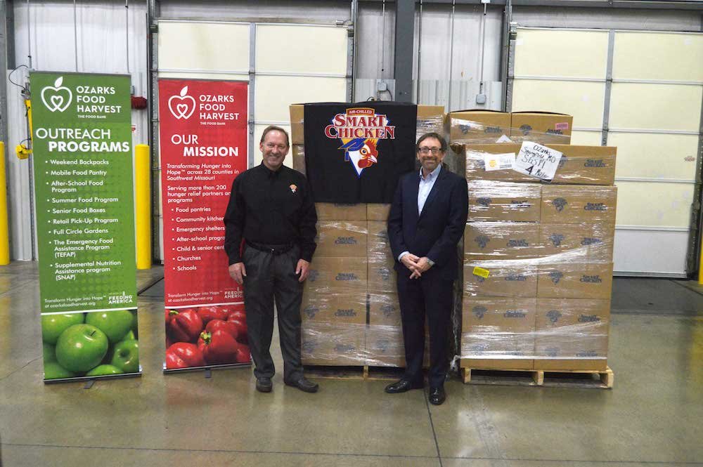 Joe Horvath, an account manager at Smart Chicken, visits Springfield to donate nearly 7,000 pounds of product to Ozarks Food Harvest, represented by CEO Bart Brown.