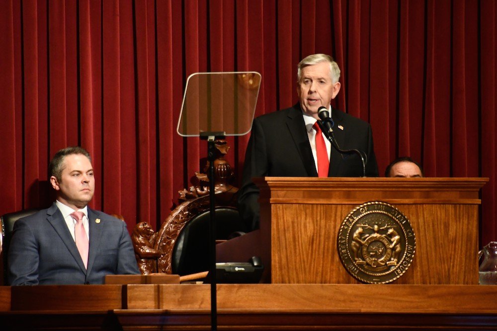 Gov. Mike Parson calls for lawmakers to set aside $100 million as a rainy day fund. At left, House Speaker Elijah Haahr, R-Springfield, listens to the annual State of the State.