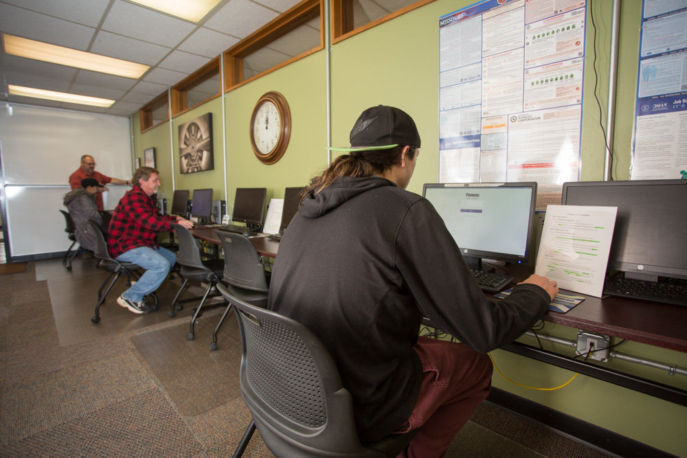 JOB HUNT: Staff members at Penmac Staffing Services help job seekers at its Springfield office.