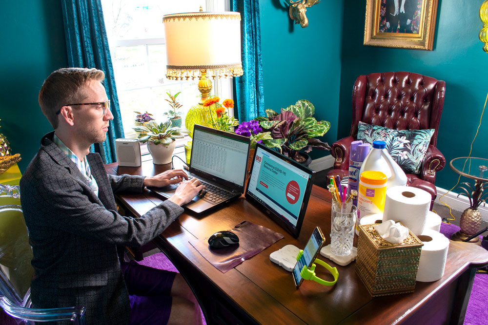 REMOTE WORKS: BKD employee Brady Nelson telecommutes from his home workspace after a company decision to operate remotely.