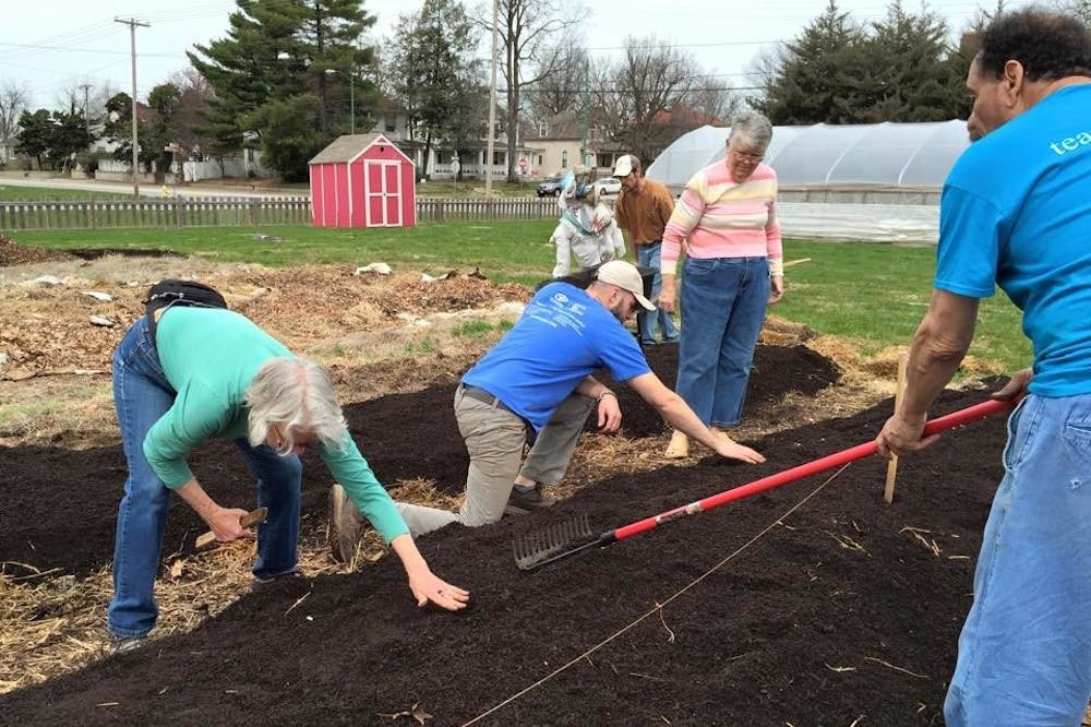 Volunteers work at Springfield Community Gardens' operation near Cox North. The nonprofit is now adding a farm by Cox South.
