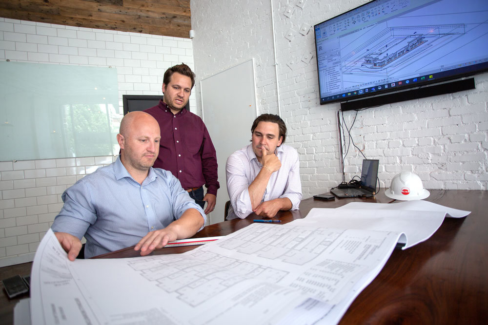 Joel Thomas, right, is principal architect at the new local office for Buf Studio, an Arkansas-based firm started in January by Ryan Faust, left, and Christophe Bouteille.