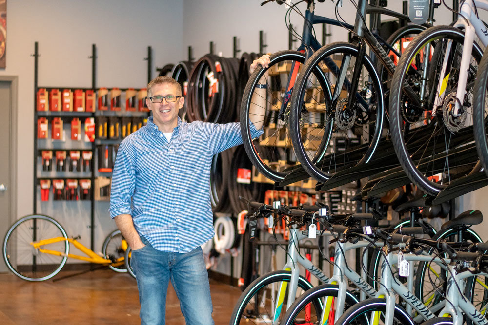 BIKE BOOST: Jason Johannpeter, co-owner of Adventure Bicycle, says the shop experienced a sales jump over the past few months, including doubling sales projections in May.