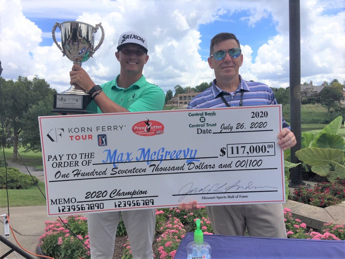 Price Cutter's Rob Marsh, right, presents a $117,000 check to tournament winner Max McGreevy.