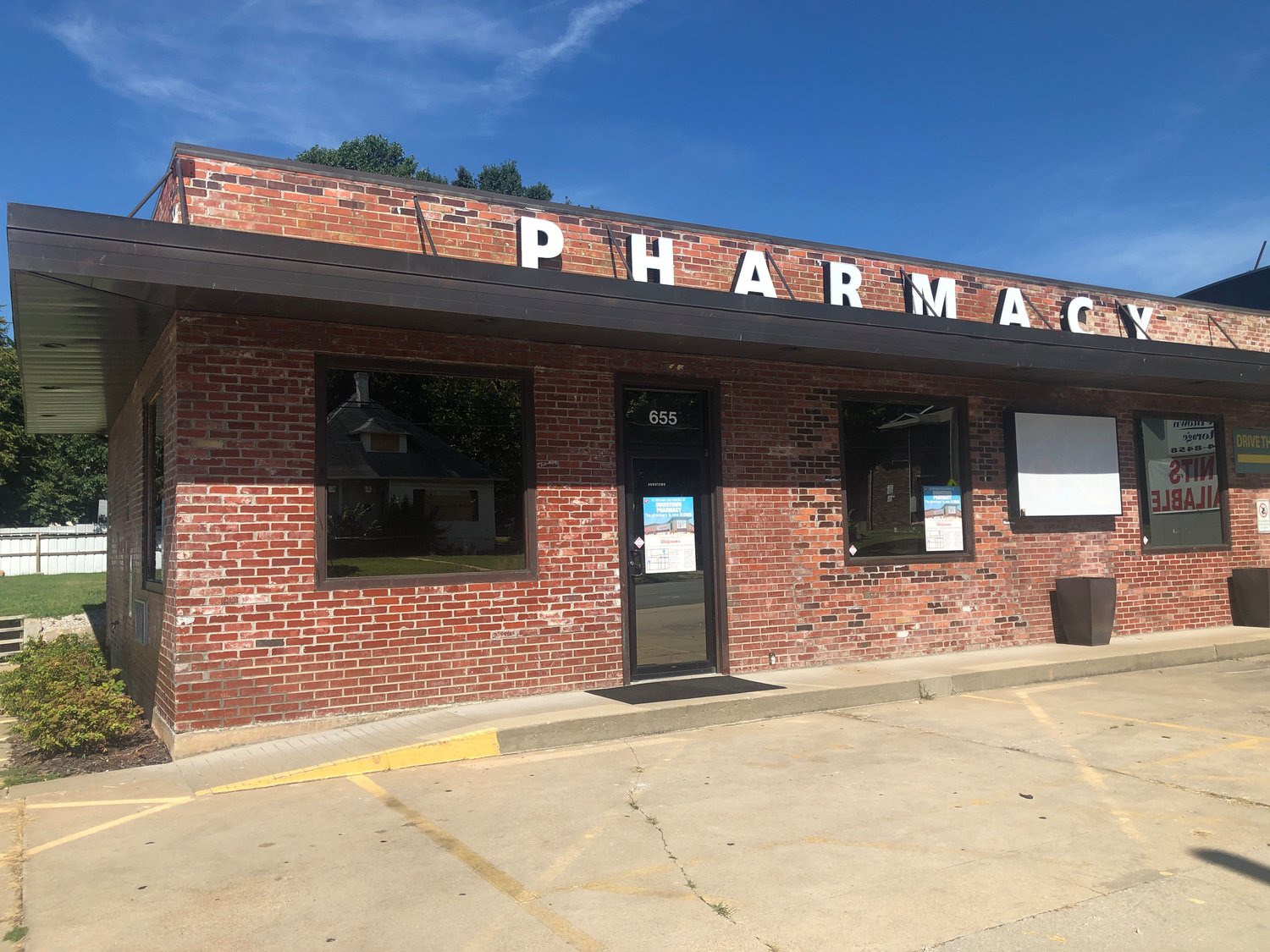 Downtown Pharmacy's prescription records have been transferred to a nearby Walgreens store, according to signage posted to the windows of the store.