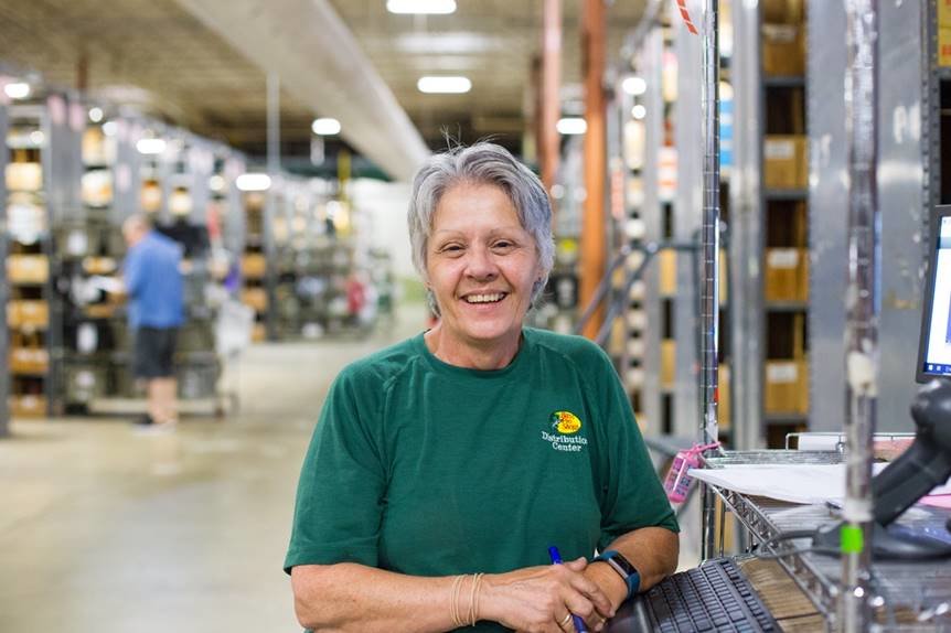 Bass Pro Shops distribution center workers are slated to receive bonuses later this year. Julie Atchison, above, is among the Springfield distribution center's employees.