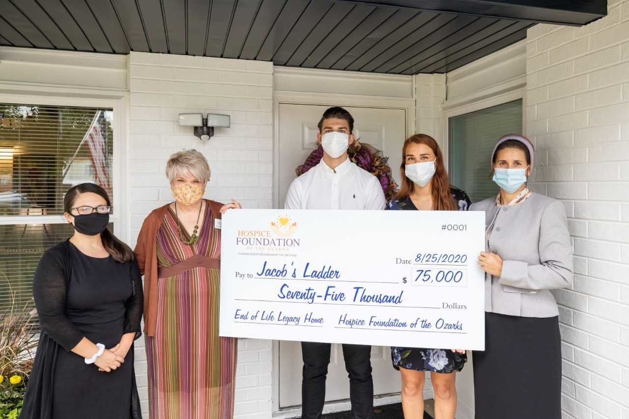 Hospice Foundation officials present a $75,000 check to Jacob’s Ladder.
