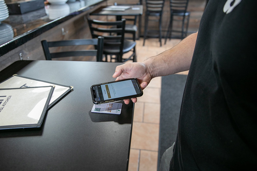 HANDS OFF: Around a dozen area bars and restaurants, such as Split Social Kitchen, utilize Touchless Menu, a product created amid the coronavirus pandemic to reduce the spread of germs and save costs.