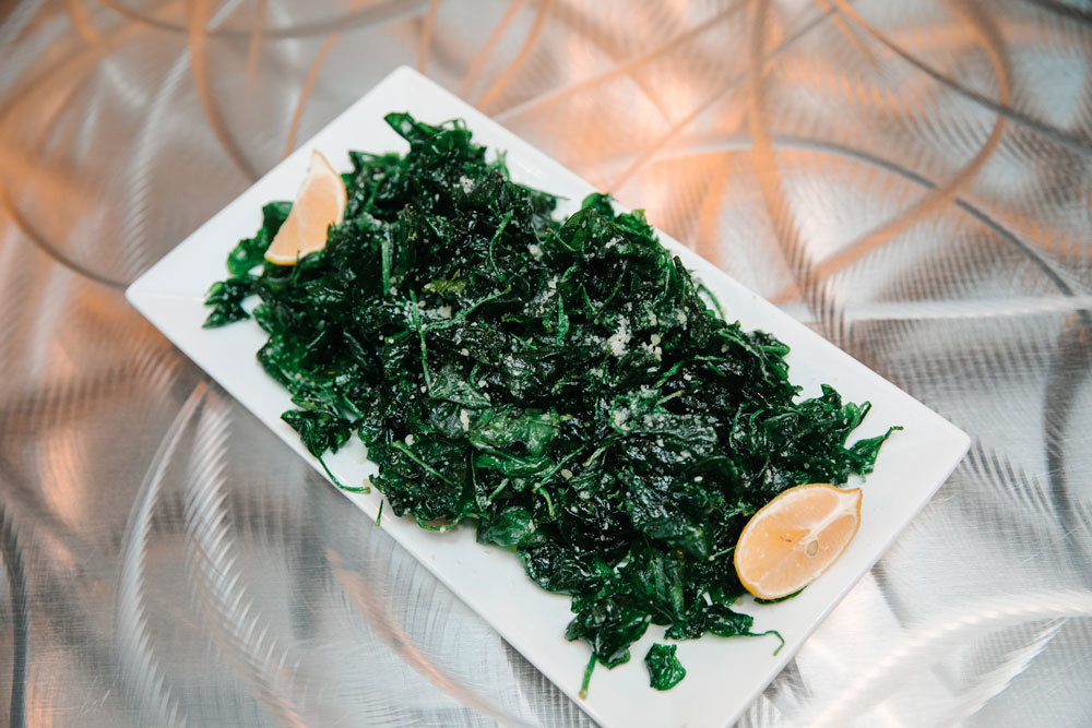 Flash-fried spinach, a staple at Metropolitan Grill, is among dishes on Retro Metro's menu.