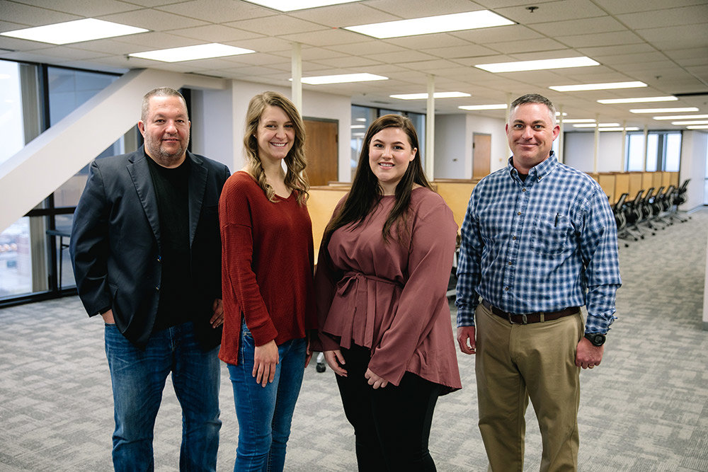 After expanding into Springfield, Promoveo plans to double its staff this year, says owner Will Westmoreland, left. He's joined in Hammons Tower by Livia Westmoreland, Heather Evans and Brent Van Deren.