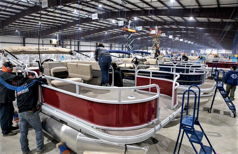 Workers are now manufacturing Tracker boats at White River Marine Group's new plant in Bolivar.