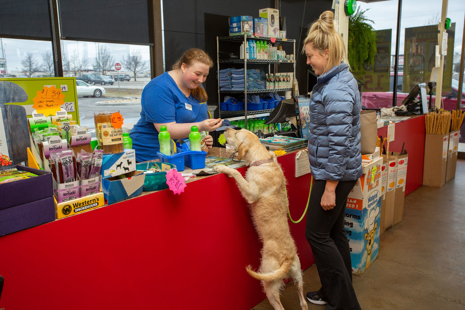 A Petsway employee serves a customer in early 2020 at the pet retailer's Glenstone Avenue store.