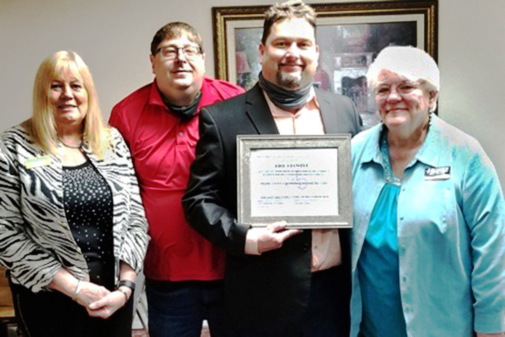 LIFETIME MEMBERSHIP
Businessperson Rich Crowell, second from right, on March 26 is presented with a lifetime membership in the Branson Show League for his charitable and civic work benefiting the city and its live music show community. Formerly with Golden Corral, Crowell recently joined the team at Commercial One Brokers.