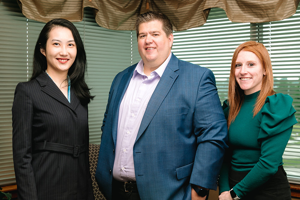 Abacus CPAs, represented above by Shuhan Gu, John Helms III and Brooke Shepherd, is among honorees for the BBB's Torch Awards.